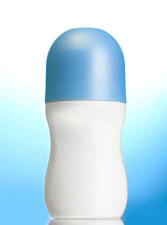 deodorant on blue backgroundの写真素材