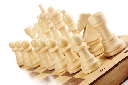 Chess board with chess pieces isolated on white