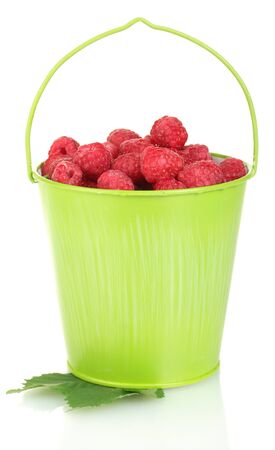 Fresh raspberries in green bucket isolated on whiteの写真素材