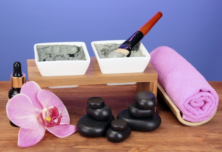 cosmetic clay for spa treatments on bright violet background close-upの写真素材