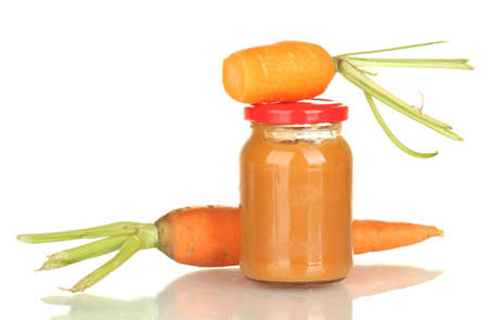 Jar with carrot baby food isolated on whiteの写真素材