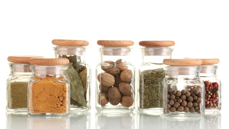 powder spices in glass jars  isolated on whiteの写真素材