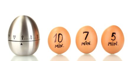 egg timer and eggs isolated on whiteの写真素材