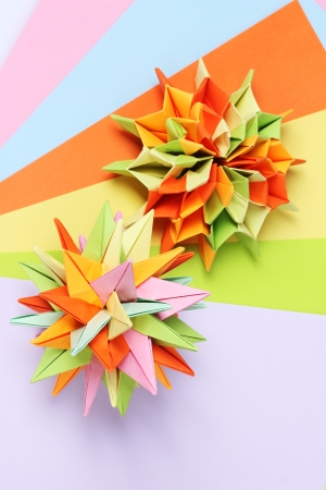 Colorfull origami kusudamas on bright paper backgroundの写真素材