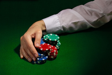 Taking win in poker on green table