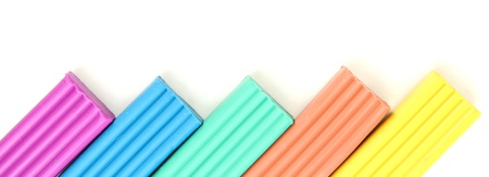 Children bright plasticine isolated on whiteの写真素材