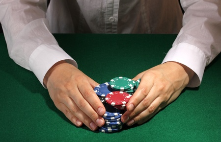 Taking win in poker on green table