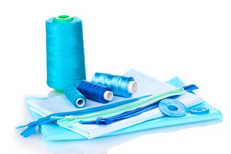 Sewing accessories and fabric isolated on white