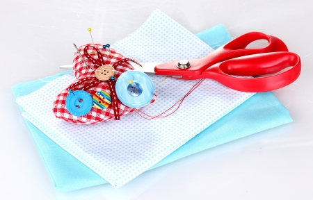 Sewing accessories and fabric isolated on whiteの写真素材