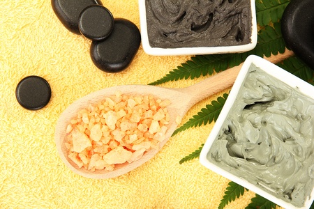 cosmetic clay for spa treatments on yellow background close-upの写真素材