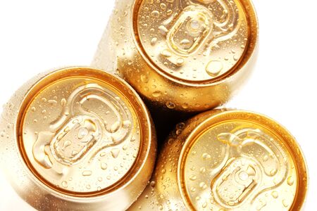 golden cans isolated on whiteの写真素材