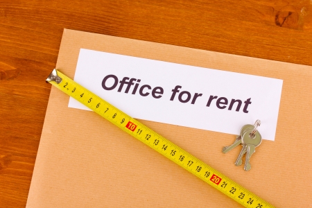 folder with information on the office leasing on wooden backgroundの写真素材