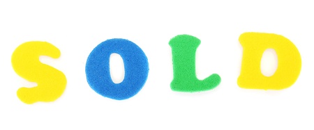 Inscription Sold of English  letters, isolated on whiteの写真素材