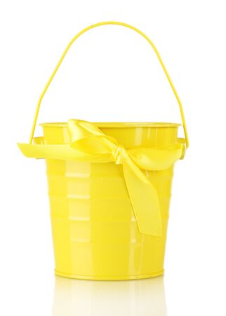 Bright yellow bucket isolated on whiteの写真素材