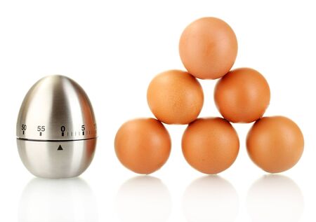 egg timer and eggs isolated on whiteの写真素材