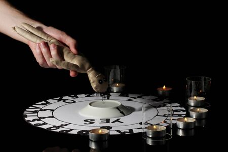 spiritualistic seance by candlelight close-up