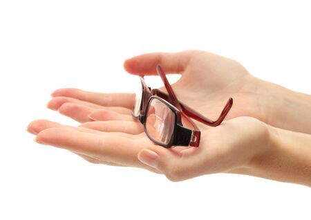 glasses on female hands, isolated on whiteの写真素材