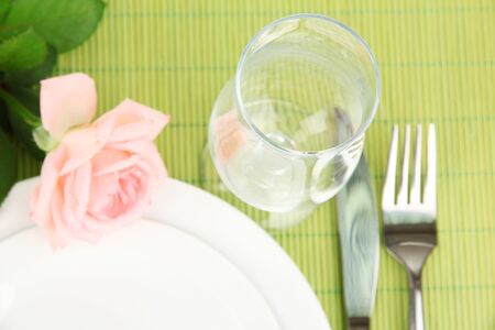 Table setting on a bamboo mat close-upの写真素材