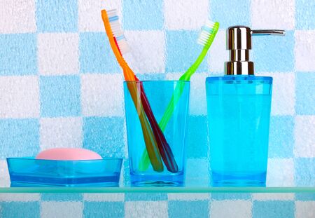 Bath accessories on shelf in bathroomの写真素材