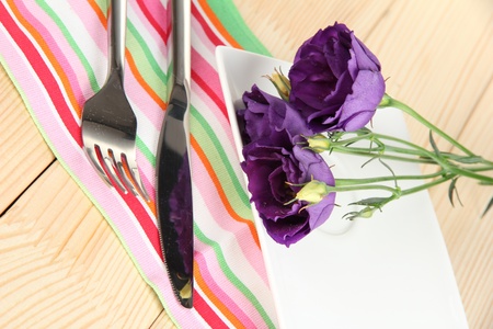 Tableware with flower on bright napkin close-upの写真素材