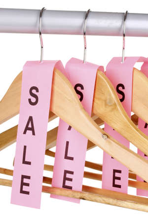 wooden clothes hangers as sale symbol isolated on whiteの写真素材