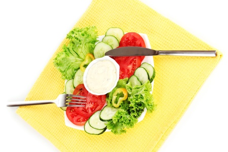 Chopped vegetables and sauce on plate isolated on whiteの写真素材
