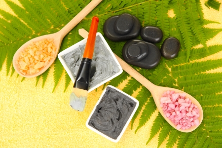 cosmetic clay for spa treatments on yellow background close-upの写真素材
