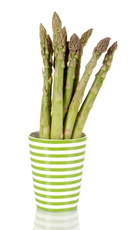 Fresh asparagus in colorful pot isolated on white
の写真素材