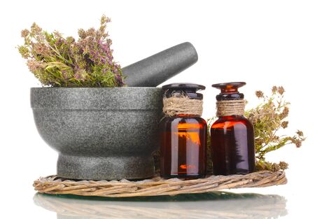 Thyme herb and mortar on wicker mat isolated on whiteの写真素材