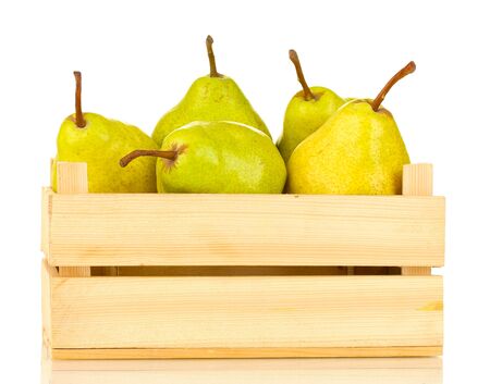 Ripe pears in wooden box isolated on whiteの写真素材
