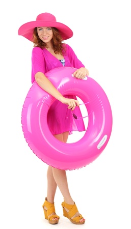 Beautiful girl with beach hat, glasses and rubber ring isolated on whiteの写真素材