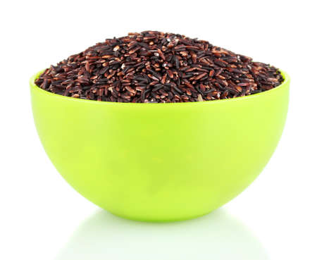 BLACK rice in a green plate , isolated on whiteの写真素材