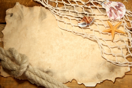 old paper, fishing net and rope on wooden tableの写真素材