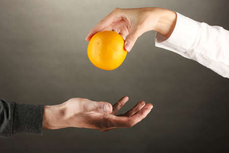 helping the homeless, on black background close-upの写真素材