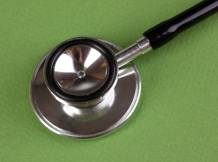 Stethoscope close-up on green backgroundの写真素材
