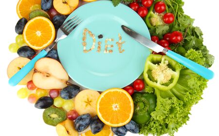 Blue plate surrounded by wholesome food diet isolated on whiteの写真素材