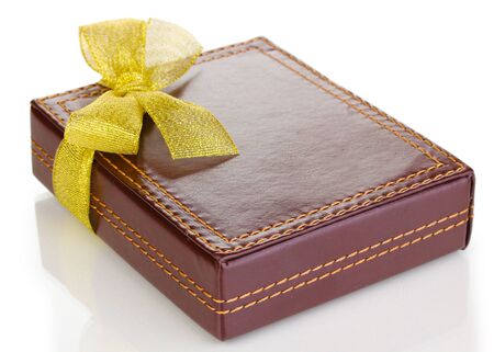 Brown box with ribbon isolated on whiteの写真素材