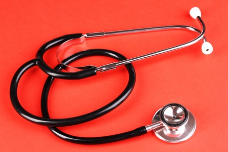 Stethoscope on red backgroundの写真素材