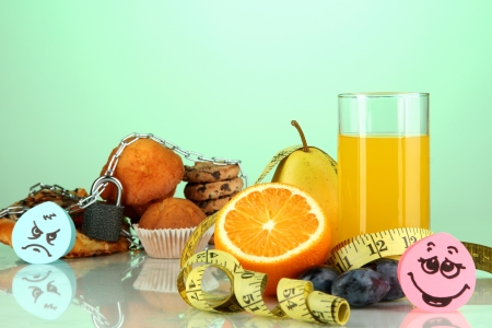 Useful and harmful food on green backgroundの写真素材