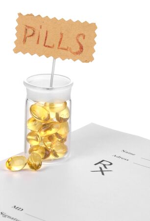 Capsules in receptacle with prescription pharmacist isolated on whiteの写真素材