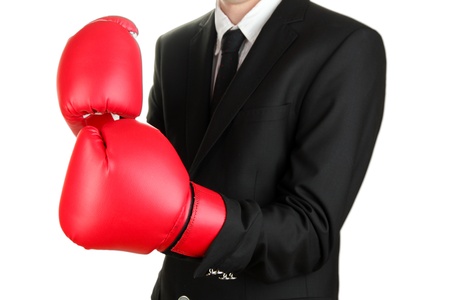 businessman in boxing gloves isolated on whiteの写真素材