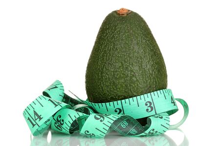 avocado with measuring tape isolated on whiteの写真素材