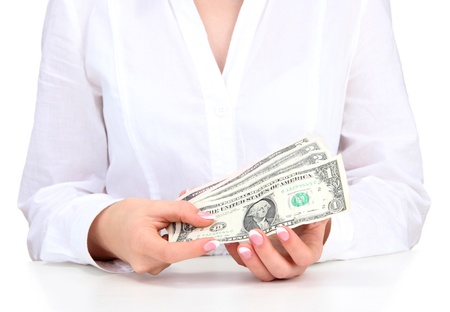 American dollars in a women hands, close up