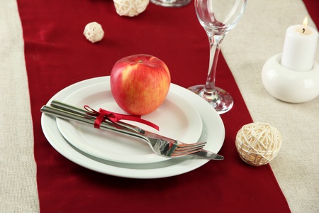 beautiful holiday table setting with apple, close upの写真素材