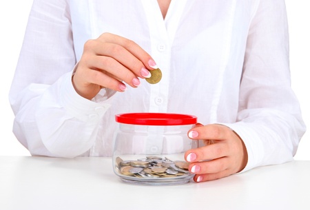 Woman hands with coins in glass jar, close upの写真素材