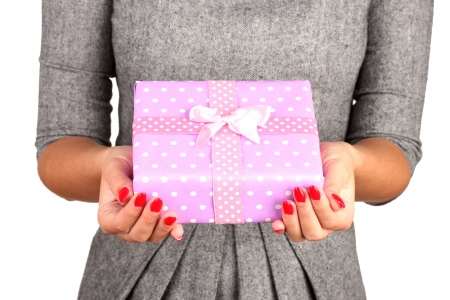 woman holds  box with gift on white background close-upの写真素材