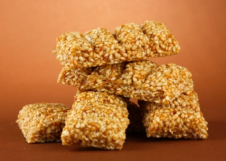 tasty sweets (kozinaki), on brown backgroundの写真素材