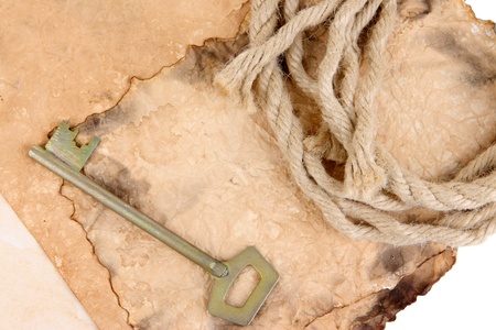 Old paper with key and rope close upの写真素材