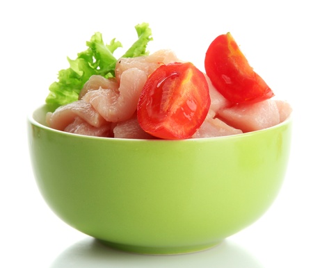raw chicken meat in bowl, isolated on whiteの写真素材