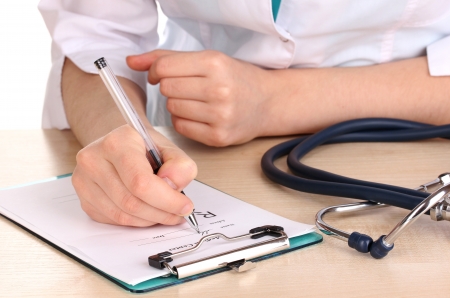 Doctor appoint prescription drugs to patients isolated on whiteの写真素材